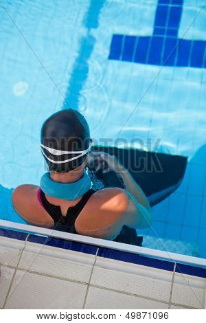 Female Swimmer At Pool Edge