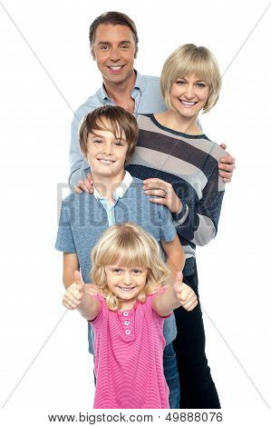 Group Portrait Of A Playful Family Of Four