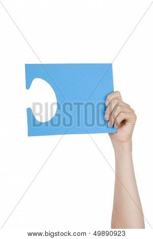 Hand Holding A Blue Puzzle