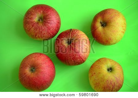 Apples on a green background