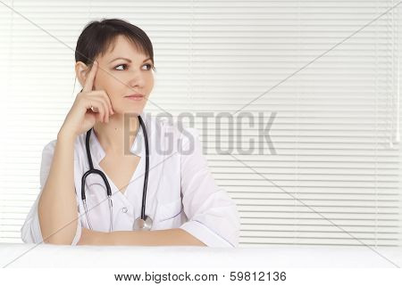 Beautiful doctor sitting