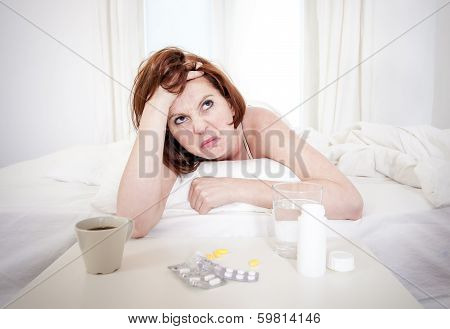 Red Haired Girl With Hangover Wanting Coffee In Bed