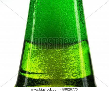 Green bottle of beer and gas bubbles