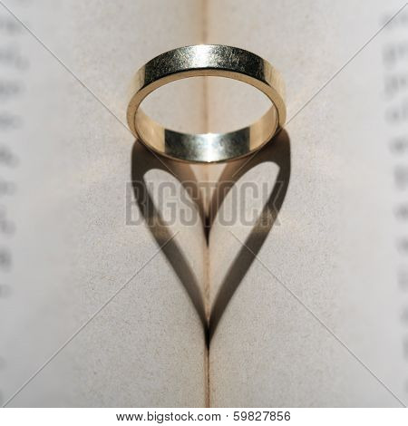 Gold ring and heart of the shadows