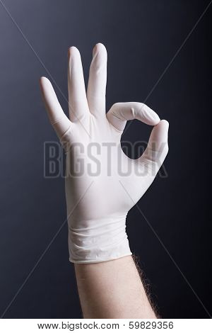 Male hand in latex glove - OK sign