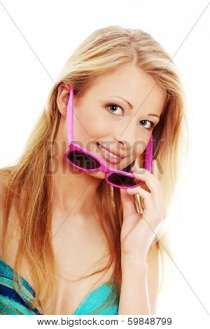 Young summer girl with pink sunglasess, isolated on white