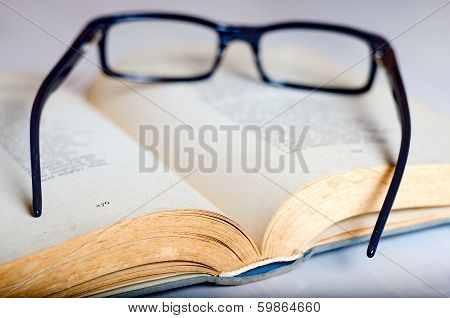 Reading Glass On An Old Book