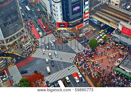 TOKYO, JAPAN - DECEMBER 15, 2012:  Traffic passes through Shibuya Crossing. The intersection is considered one of the world's busiest scramble crosswalks.