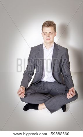 Young Businessman Posing, Meditating.