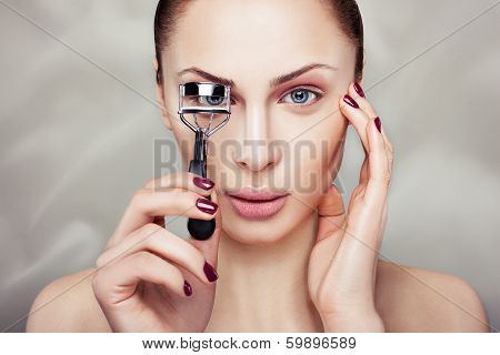 Girl With Curling Eyelashes.