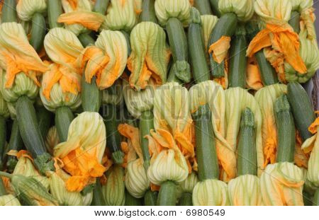 Baby zucchinis with edible flower blossoms