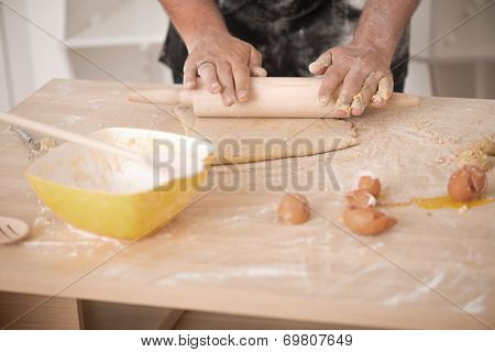 Baker preparing dough