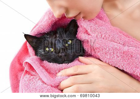Woman Holding Cute Black Soggy Cat After A Bath