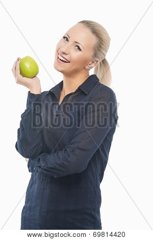 Dental Health Concept: Causasian Blond Female With Green Apple In Front Of Her Mouth
