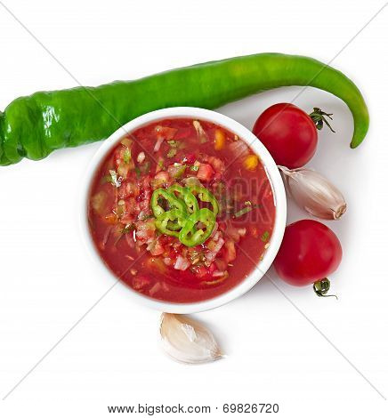 Bowl of fresh salsa dip isolated on white background