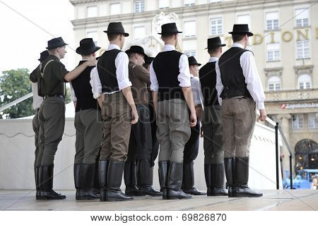 ZAGREB, CROATIA - JULY 19: Members of folk groups Nograd  from Salgotarjan, Hungary during the 48th International Folklore Festival in center of Zagreb, Croatia on July 19, 2014
