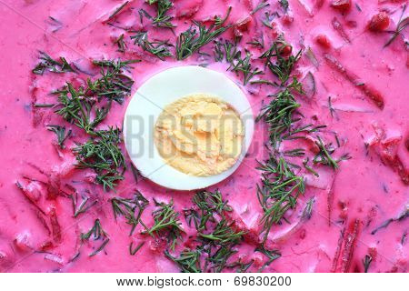 Cold soup closeup. Cold beet soup with egg and dill. Vegetarian soup.
