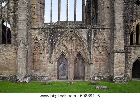 WALES, UK - 26 JULY 2014: Tintern abbey cathedral ruins. Abbey was established at 1131. Destroyed b