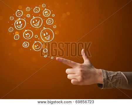 Group of happy hand drawed smiley faces coming out of gun shaped hands