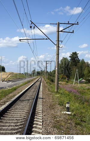 A Railway Under Blue Sky With Clouds Of White
