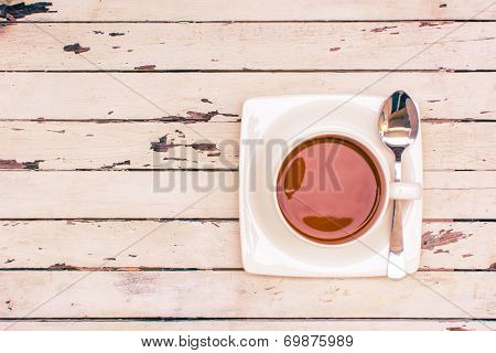 Cup Of Coffee On Wooden Table