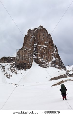 Hikers At Snowy Cloudy Mountains