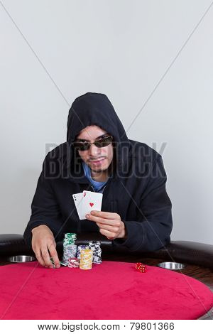 Poker Player Shows Winning Pocket Aces