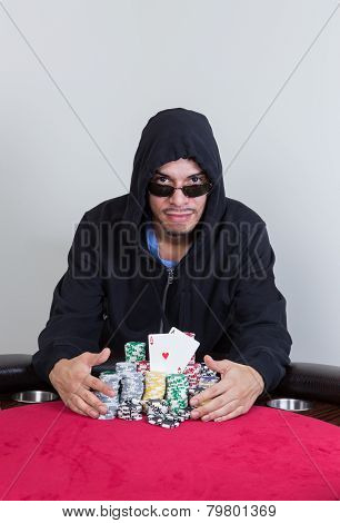 Poker Player Shows Winning Pocket Aces