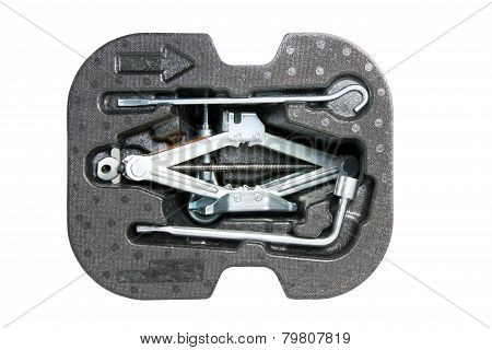 Car Jack And Basic Tool Isolated On White.