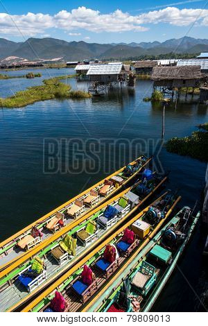 Beautiful urban landscape in Inle, Myanmar with house over the lake and boats