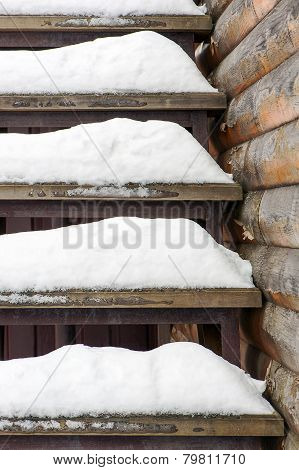 Powdery Snow Covered Old Wooden Stairs.