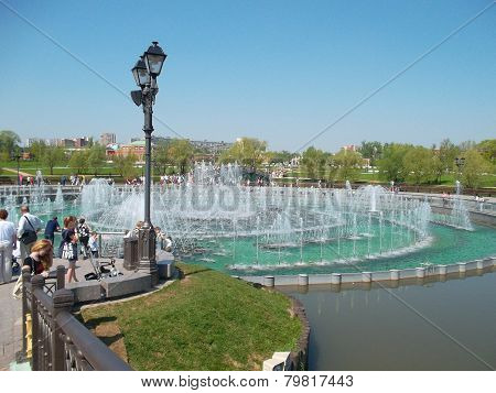 Fountains In The City. Lamp Post. People