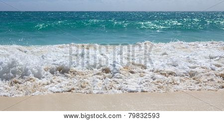 Snow-white foam of the Caribbean Sea. Playa los Cocos. Cayo Larg