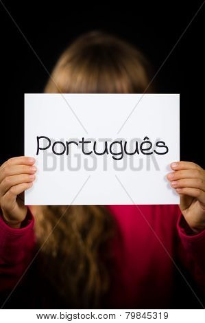 Child Holding Sign With Portuguese Word Portugues - Portuguese In English