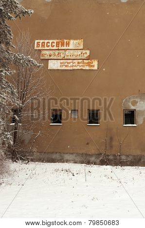 The old signboard on the ruined house