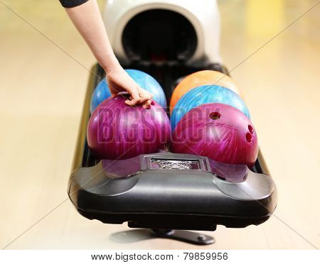 Colorful Bowling balls in ball return