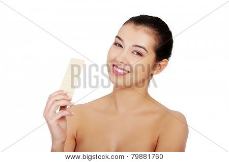 Beautiful woman holding a waffer