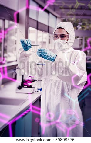 Science and medical graphic against portrait of a protected female scientist pouring liquid in a erlenmeyer flask