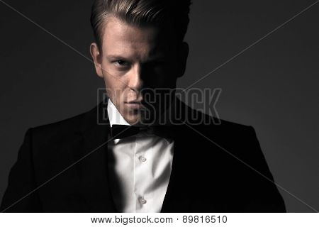 Sharp dressed man wearing jacket and bow tie