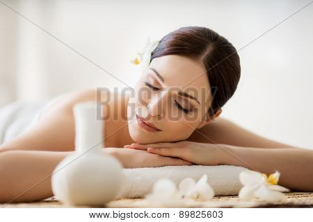 Young, beautiful and healthy woman in spa salon. Traditional oriental aroma therapy and beauty treatments. 