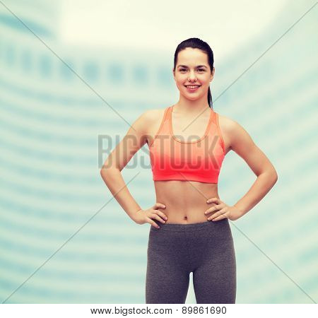 fitness and diet concept - smiling teenage girl in sportswear