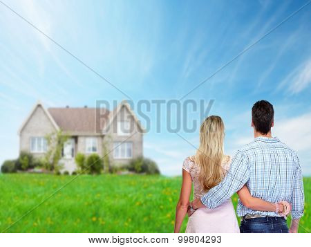 Young loving couple looking at new home. Mortgage.