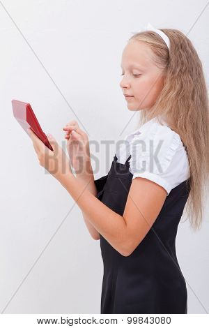 Portrait of teen girl with calculator on white background
