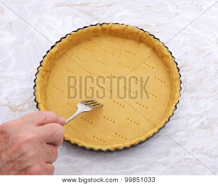 Woman Finishes Pricking Holes In A Pastry Pie Crust