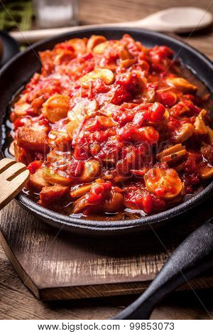 Stew With Peppers, Onions And Sausages.