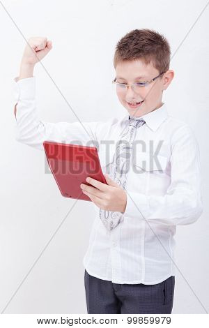 Portrait of teen boy with calculator on white background