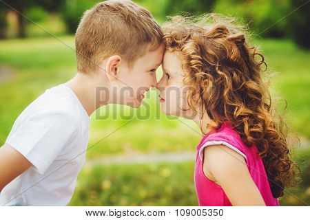 Brother And Sister Confronted Foreheads.