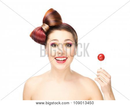 Attractive happy girl with a chupa chups.