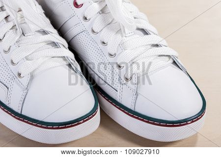Closeup Of Fashionable Modern Laced Sneakers In White.