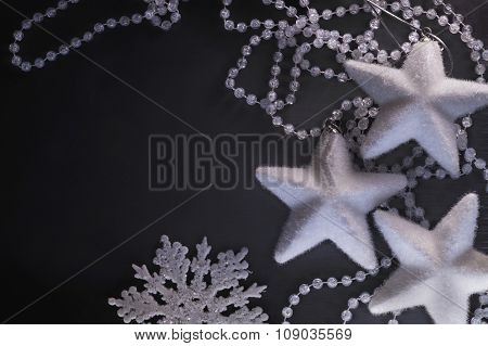 Three white stars snowflake and beads